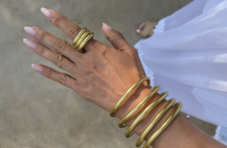 A large wrapped bracelet in silver or gold